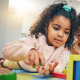 two young children playing with blocks