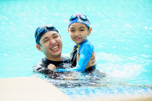 father and son in pool